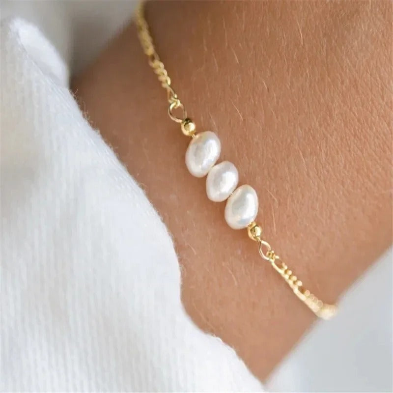 QMHJE anchor clasp bracelet with sailor wheel and twisted rope chain. Stainless steel nautical jewelry for men and women in gold or silver.