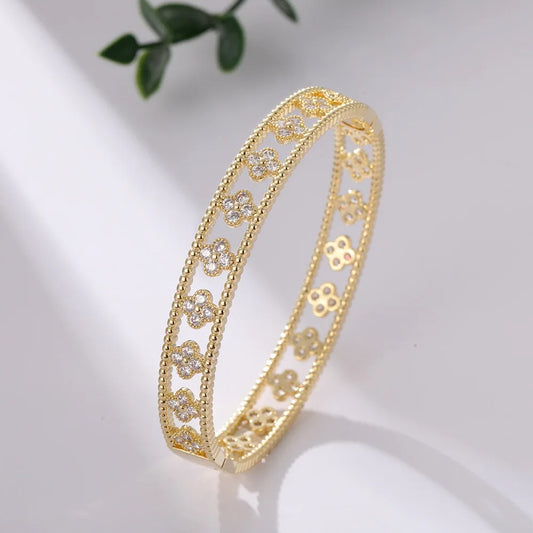 high quality Trendy fashion gold plated brass jewelry four clover leaf shape skeleton court style bangle bracelet for woman